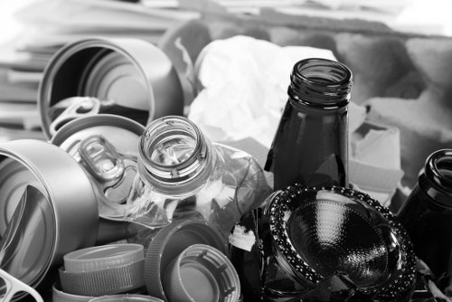 Vans loading reusable furniture during a house clearance in Chertsey