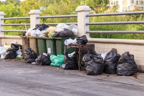 Investigator taking notes during a site visit for waste clearance