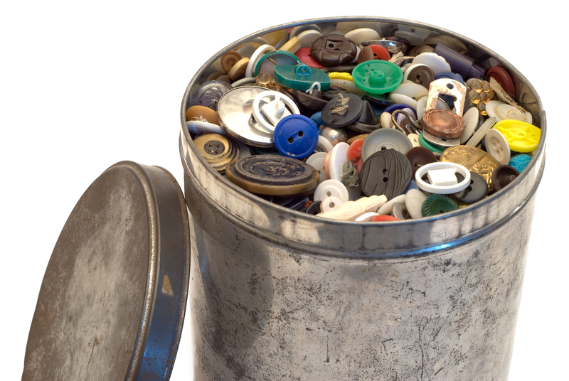 Selection of worn pots and pans ready for metal recycling at UK centre